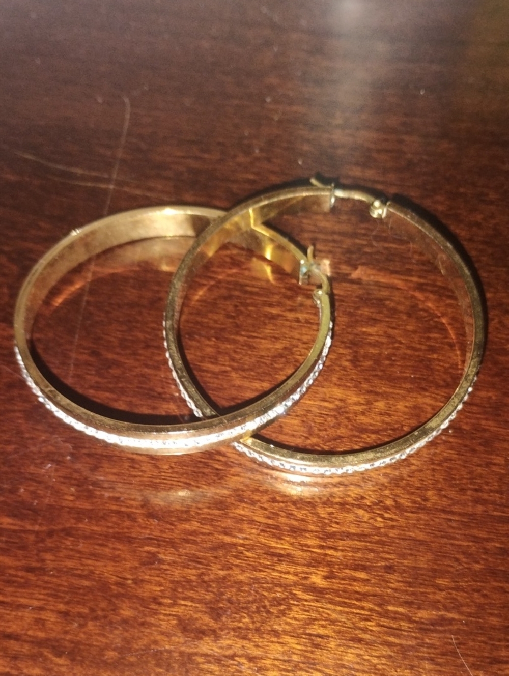 Gold Hoop Earrings With A Twist😌